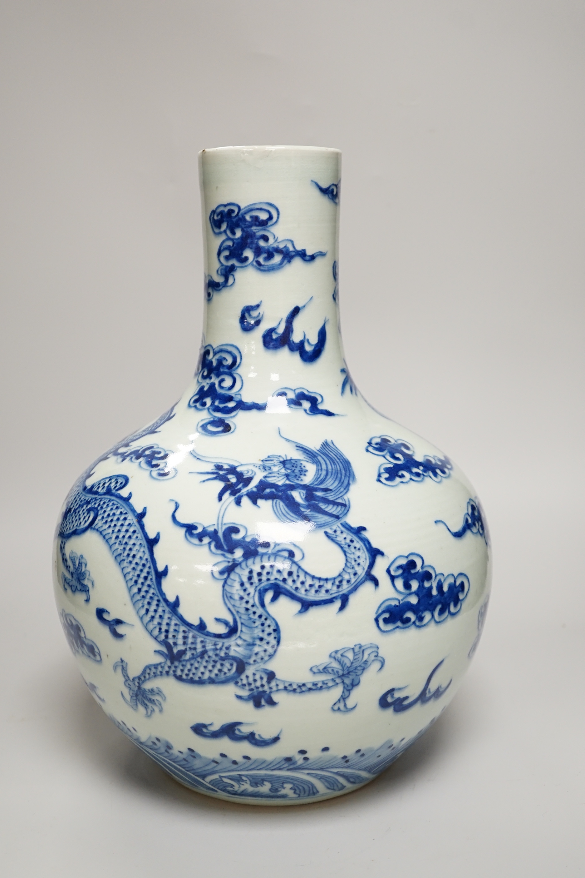 A Chinese blue and white ‘Dragon’ vase, tianqiuping, Qianlong mark but 19th century, 34cm